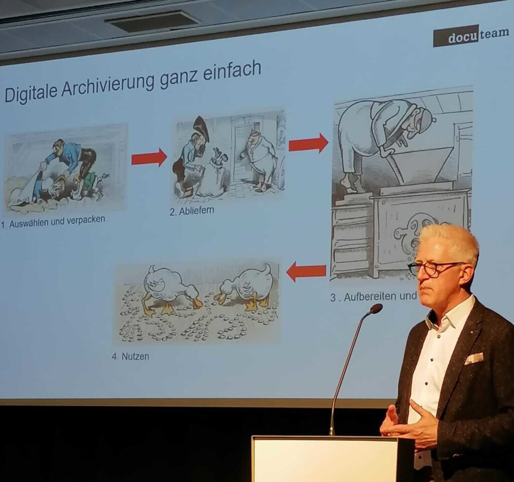 Das Bild stellt eine Person dar, die gerade einen Vortrag hält.